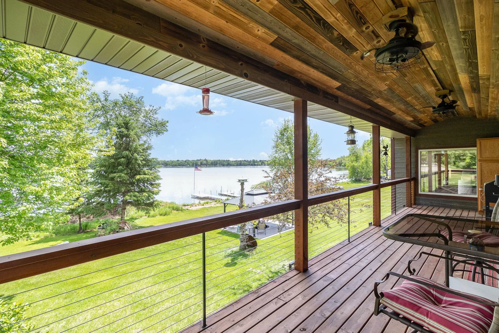 Covered deck with custom ceiling fans are perfect for staying cool and keeping bugs away