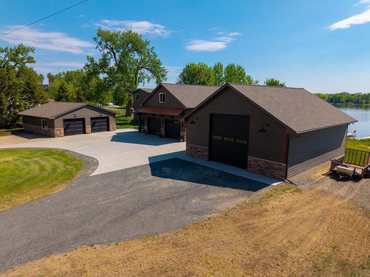 30' x 40' garage with 14' high door. Scissor trusses inside to maximize storage height. This garage has in floor heat ready, just need to hook up a boiler.