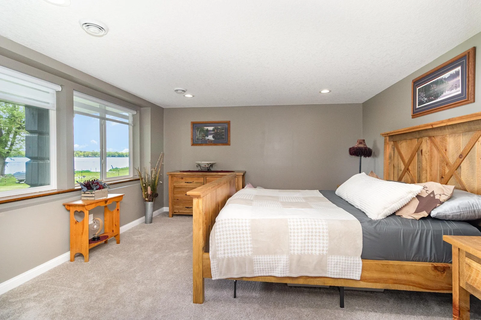 Primary bedroom in the mother in law suite offers excellent lake views