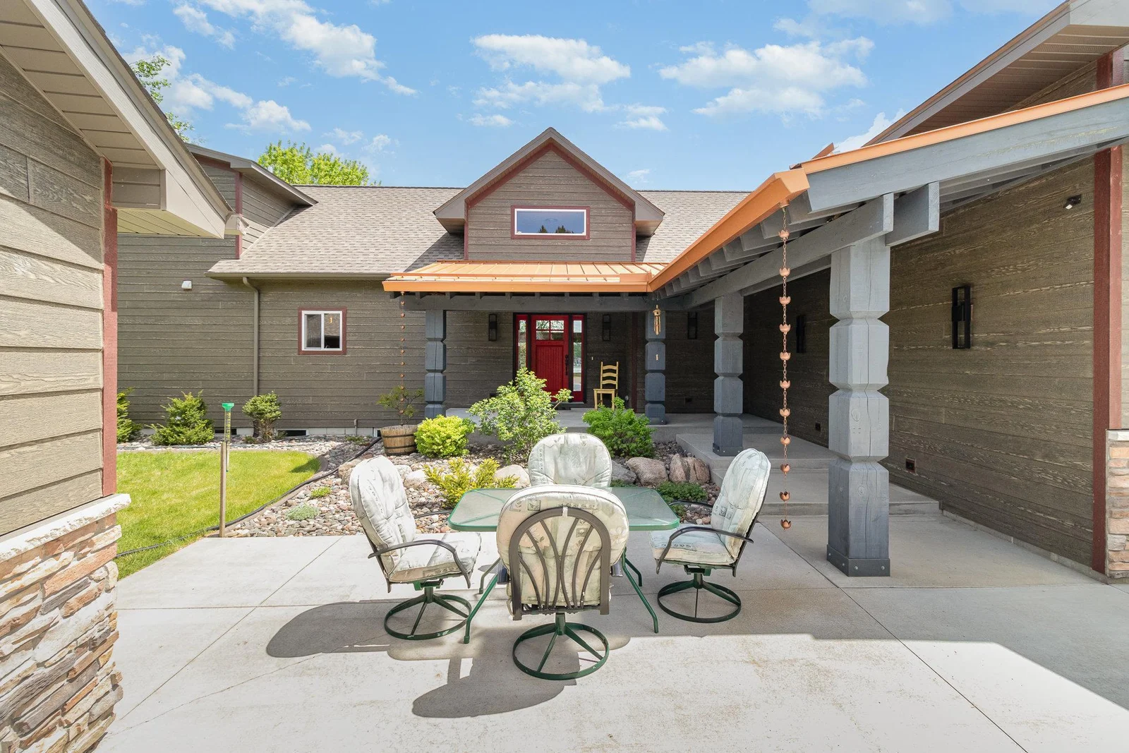 Large concrete patios surround the home to ensure all guests have areas to relax