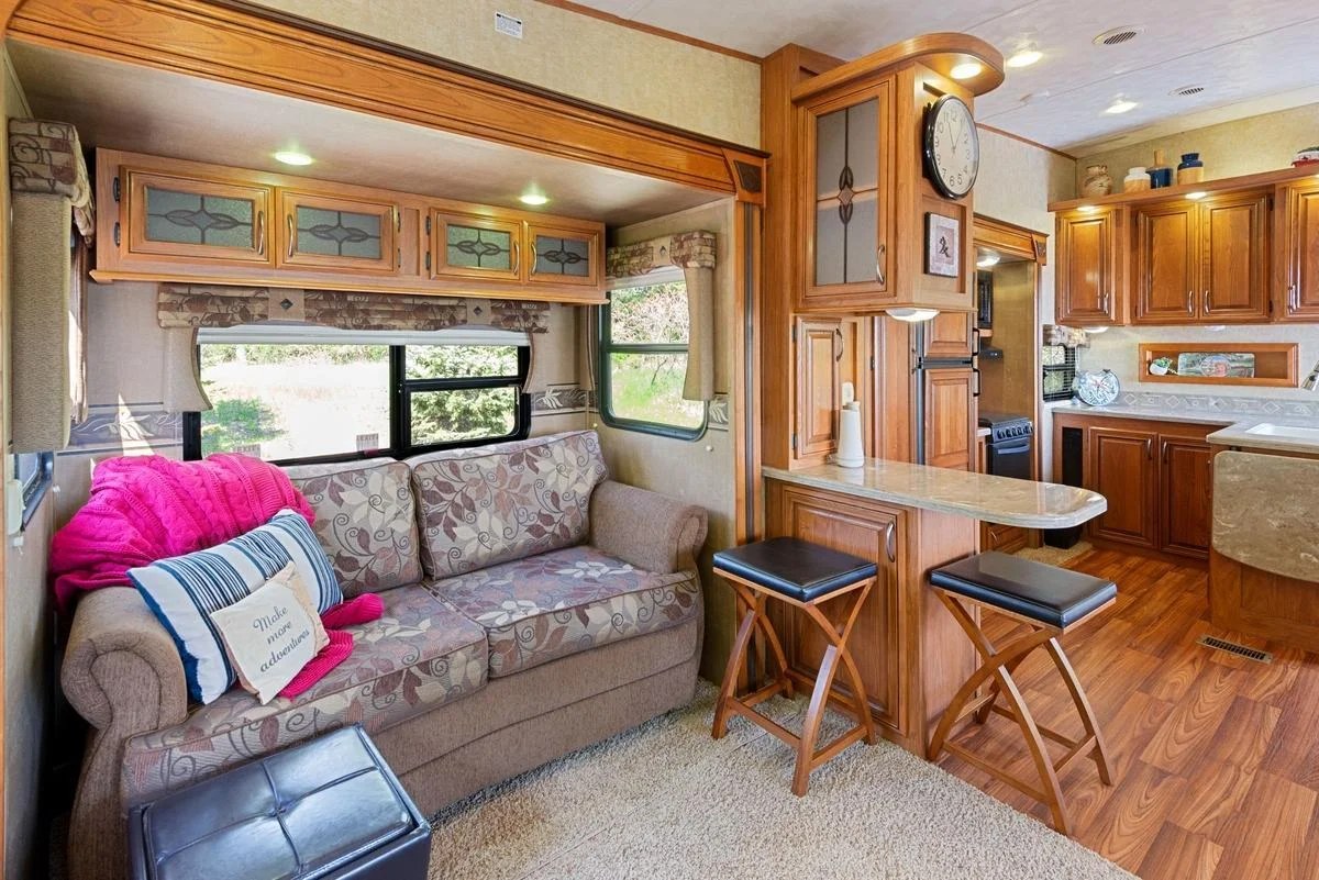 The warm wood finishes and thoughtful layout create a cozy and efficient living space that blends comfort with function.