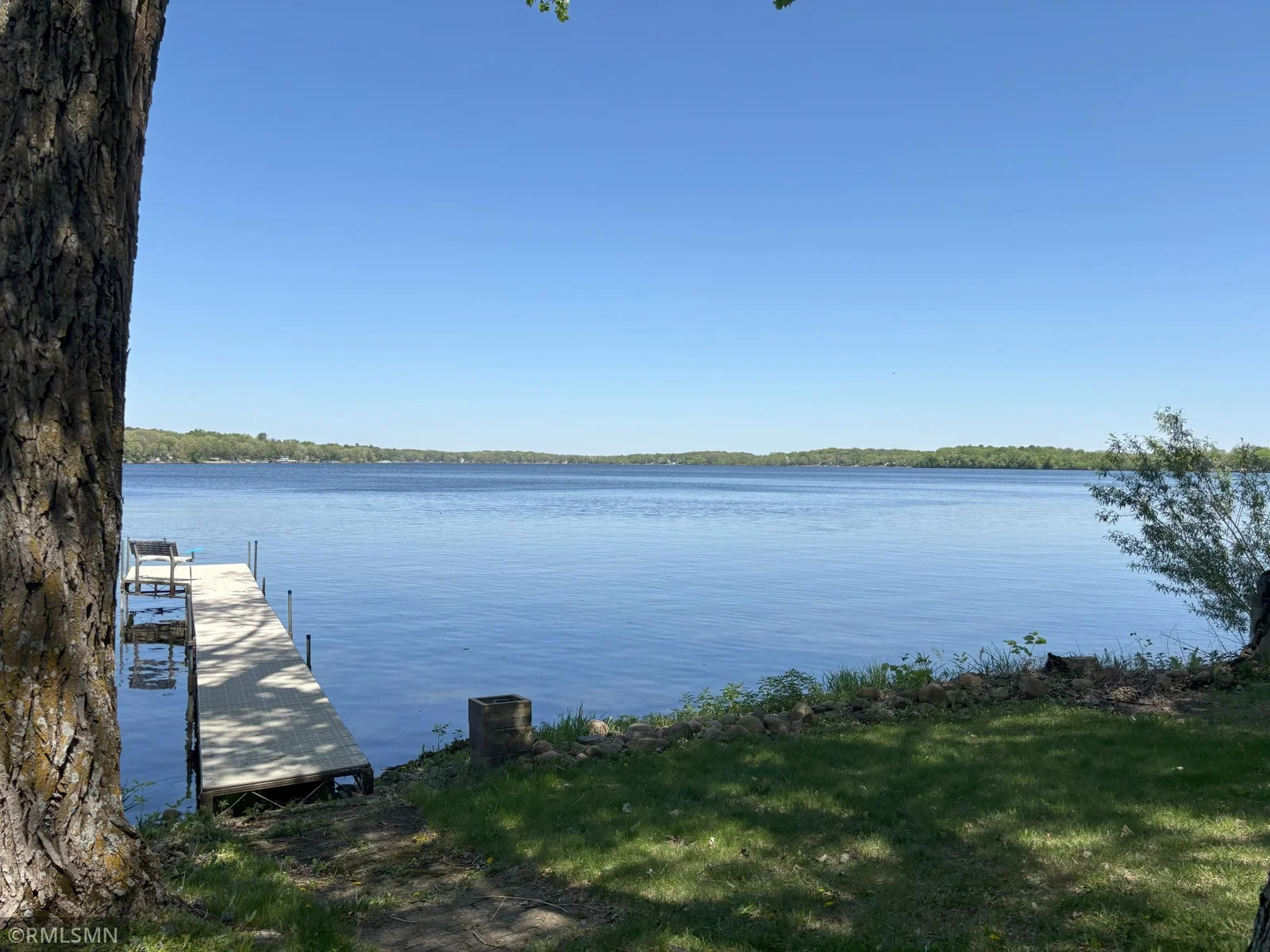 Newer dock with bench seating and great view of Briggs Lake!