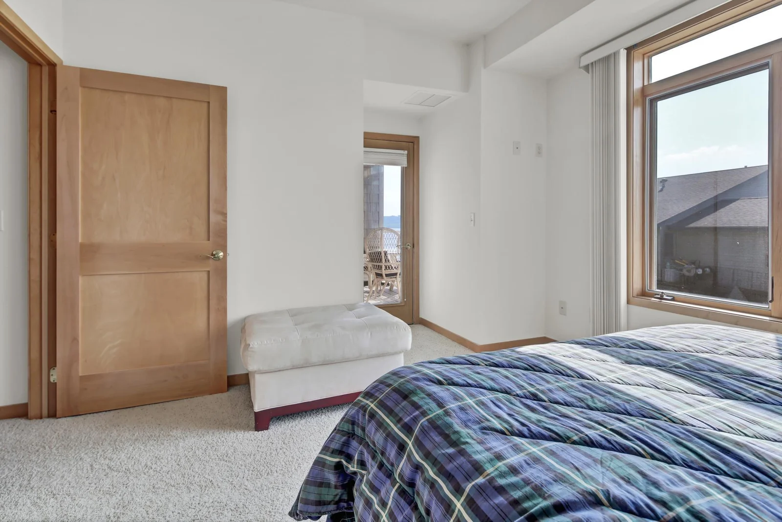 Primary bedroom with balcony access