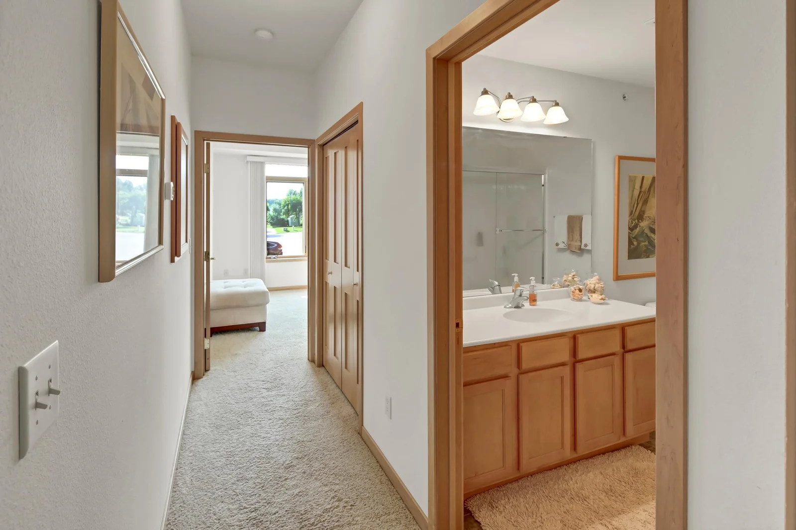 Hallway to primary bedroom and bath