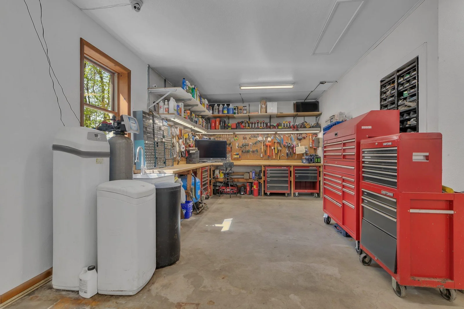 Interior of Garage. Roll-away tool chests do not convey.