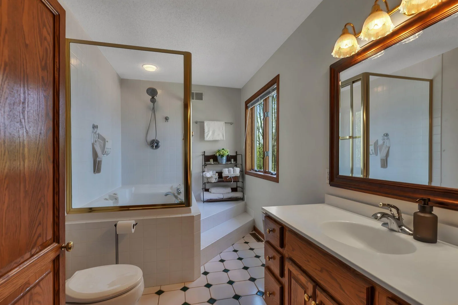 Primary Bedroom Ensuite Private Full Bath features a combination Jetted Tub and Shower.