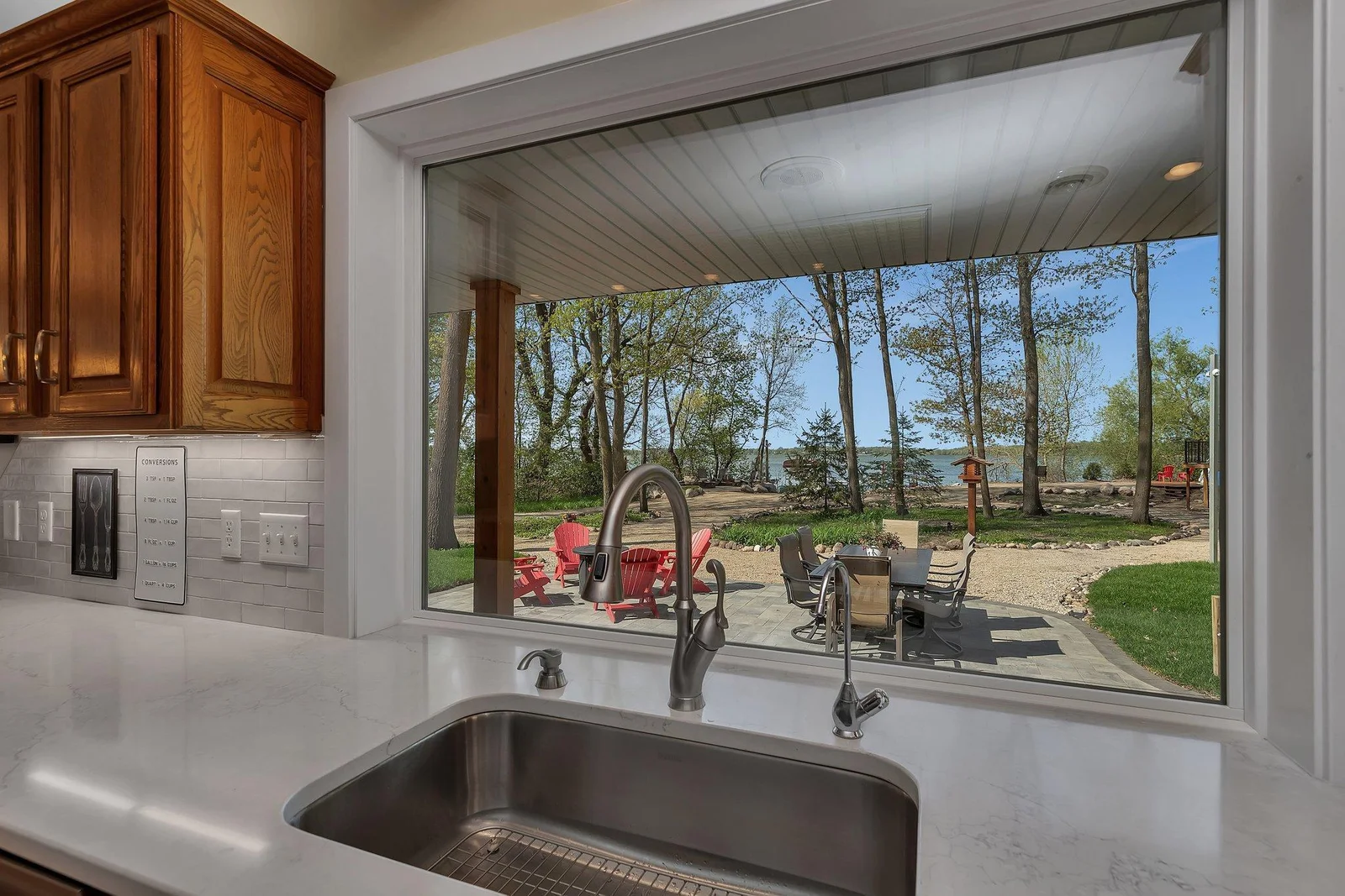 Picture window above kitchen sink.