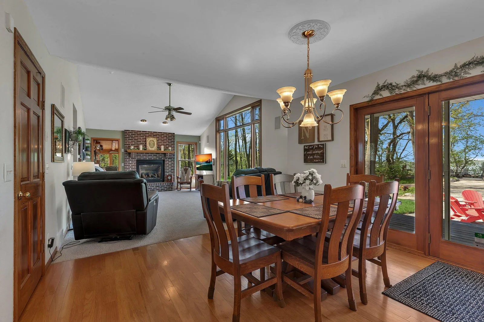 Informal dining opens to the living room, kitchen, and veranda.