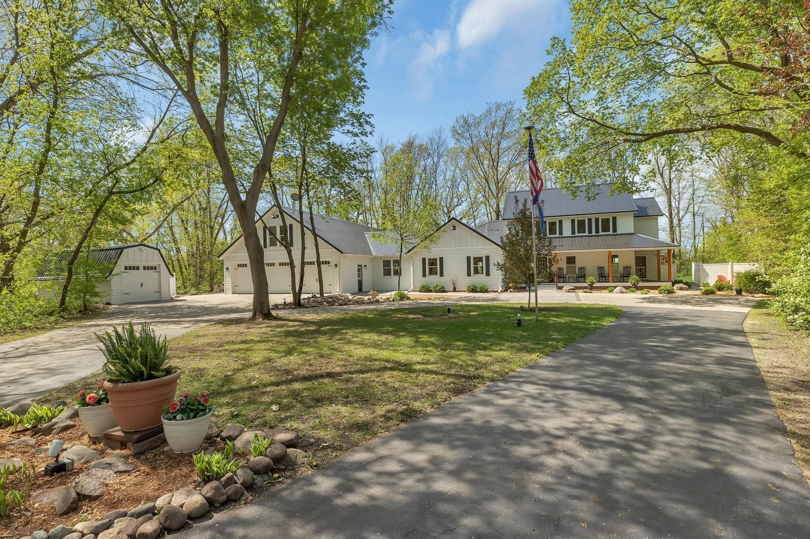Circular Driveway leads you to the Home. Exterior completely redone in Modern Farmhouse Style. New roofs, siding & more!