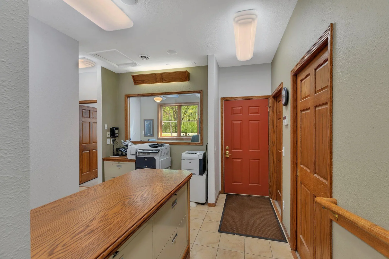 View from the reception desk to the attached garage entrance & office suites