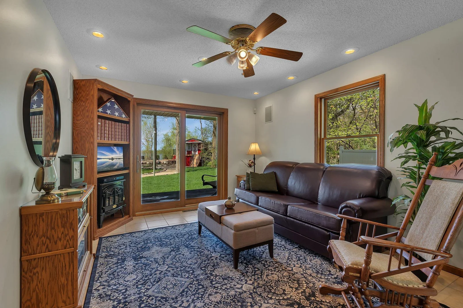 Main floor sunroom off the kitchen. Sliding glass doors open to the back porch.