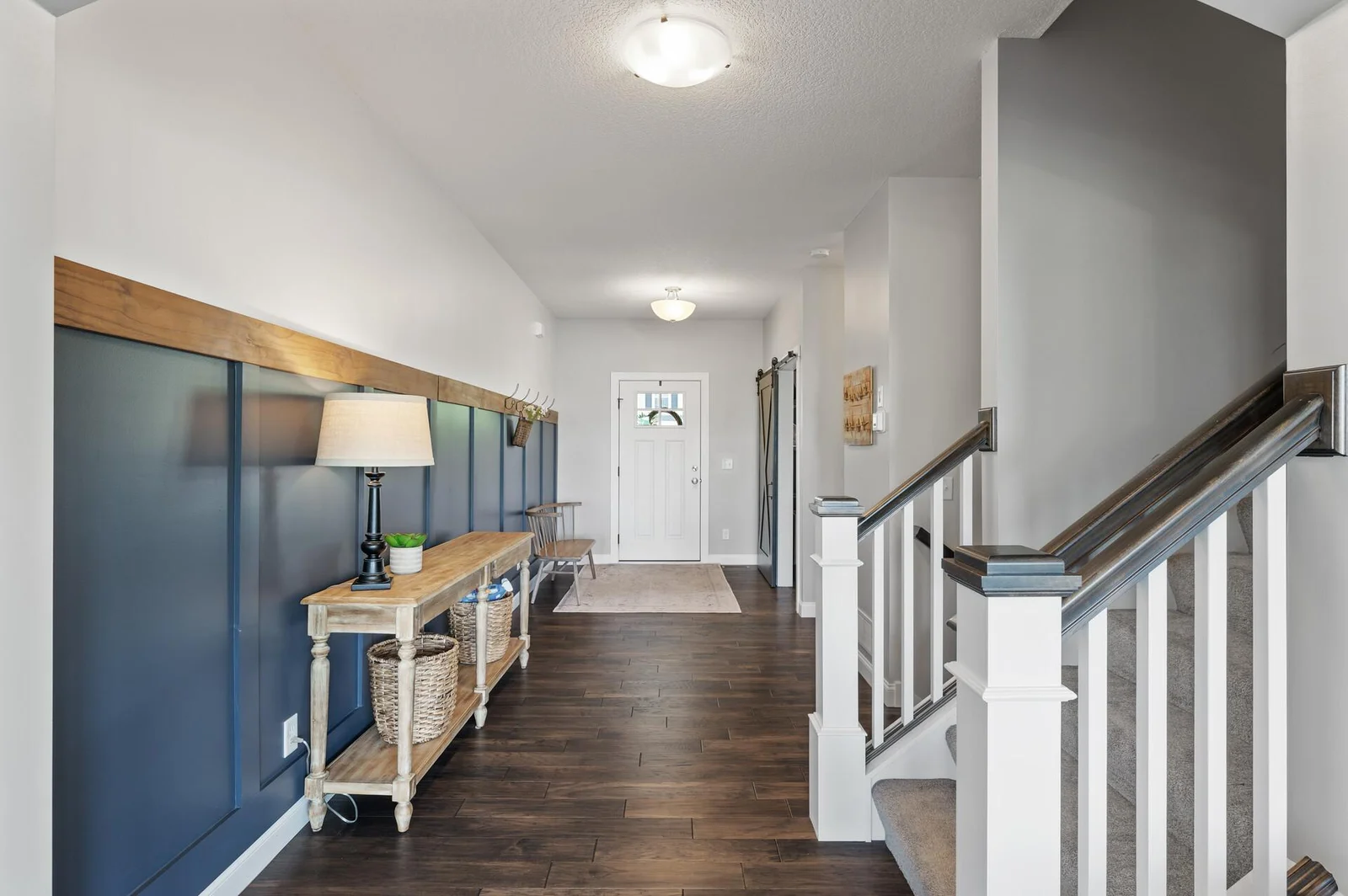 Beautiful dark, rich hardwood floors in the entry way will stand the test of many footsteps coming and going.