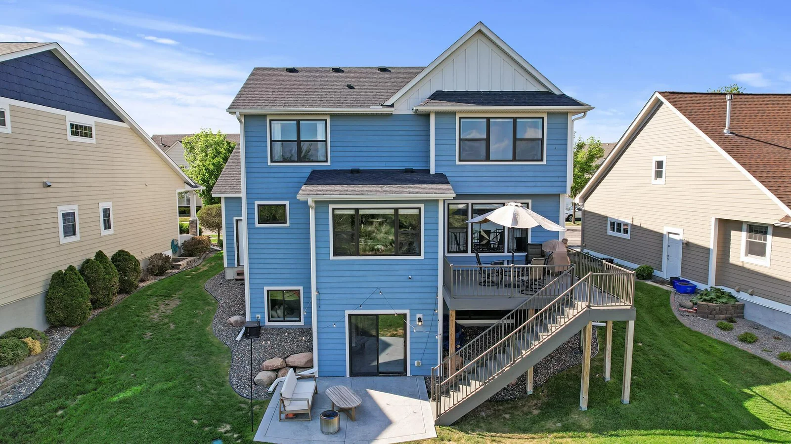 Living space extended to the back with patio and maintenance free deck.