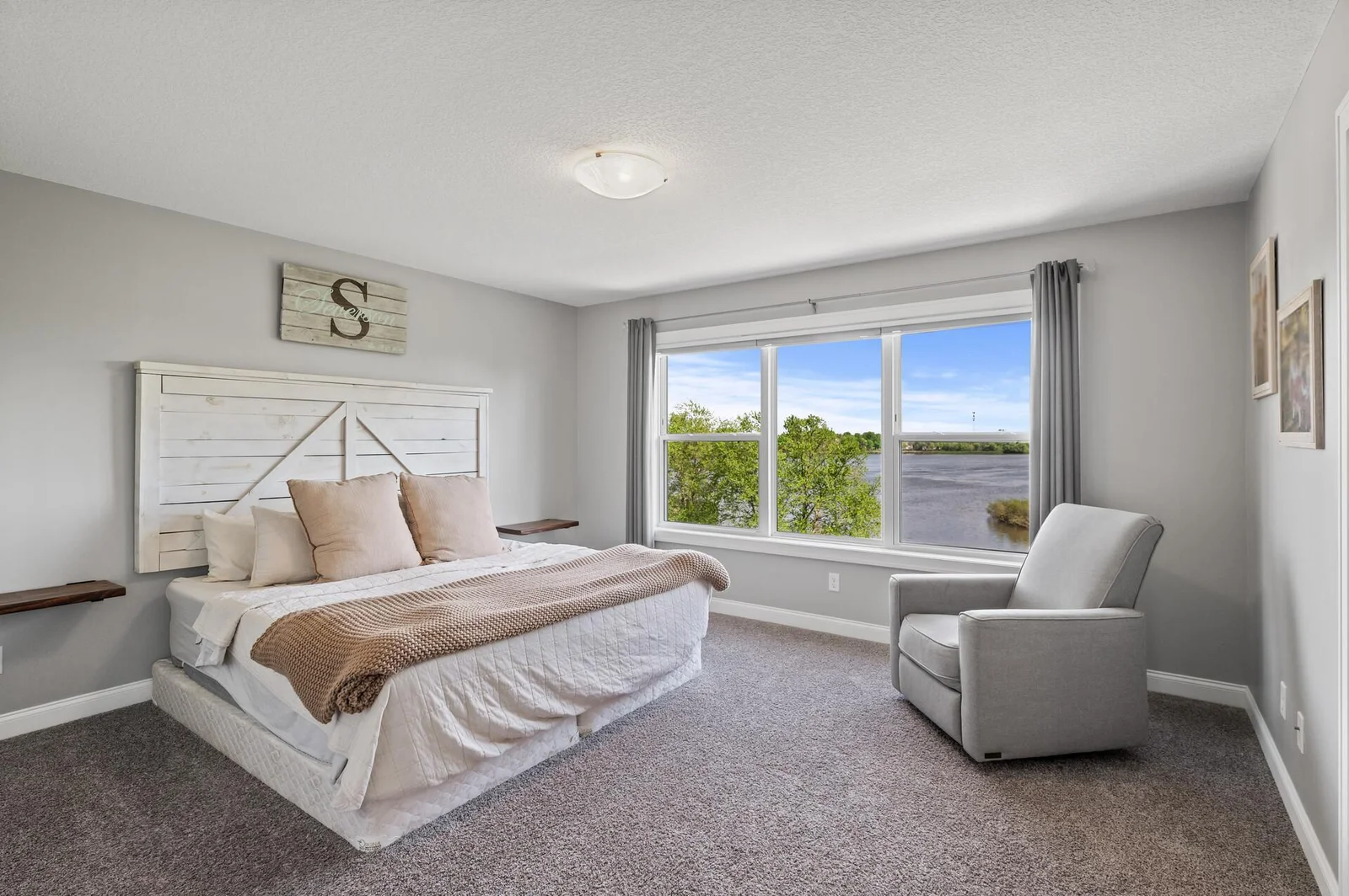 Primary bedroom with a wall of windows spanning 9' x 5'