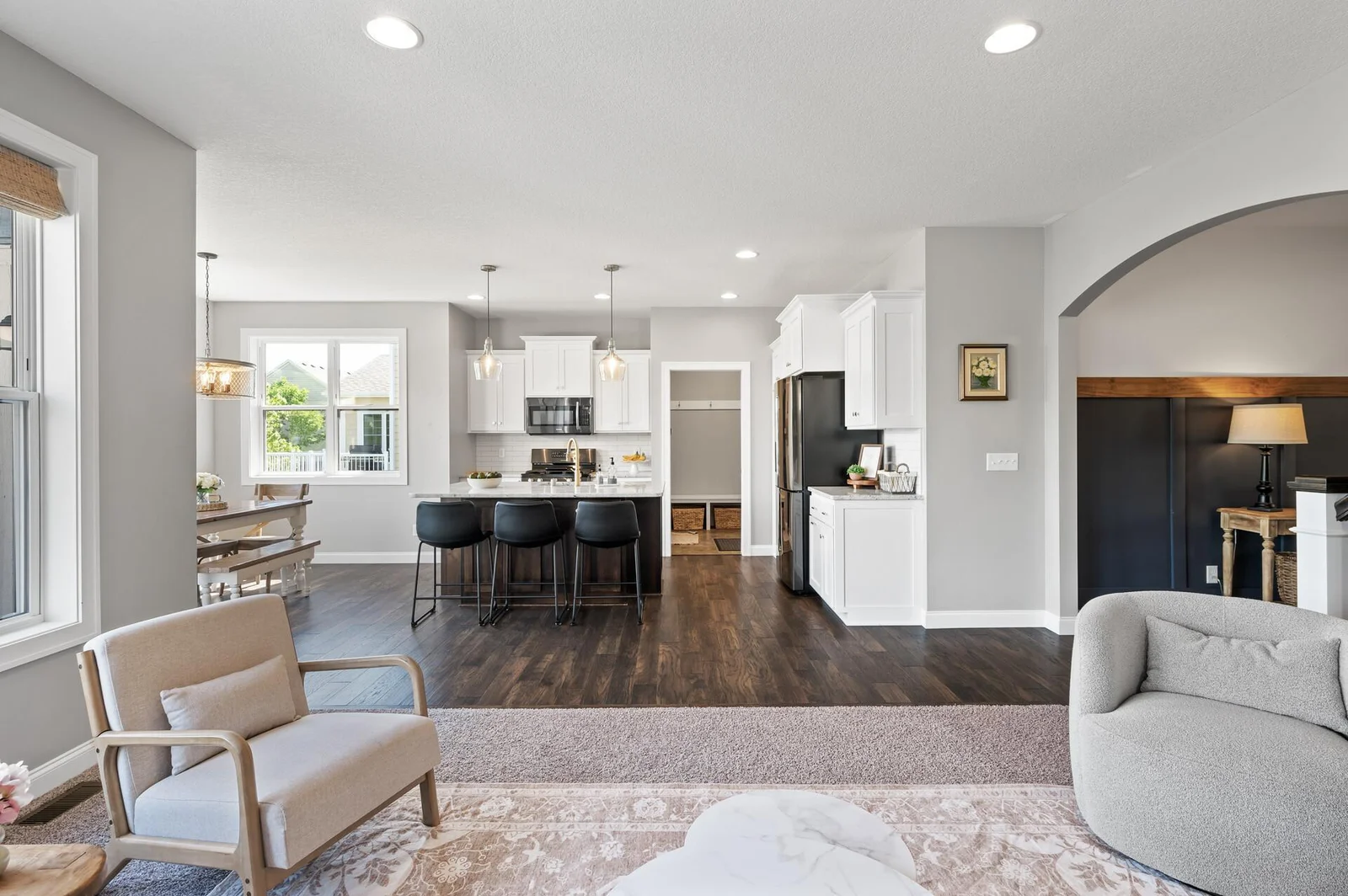6'x4' granite kitchen island. Pocket door separates the kitchen from the garage entry.
