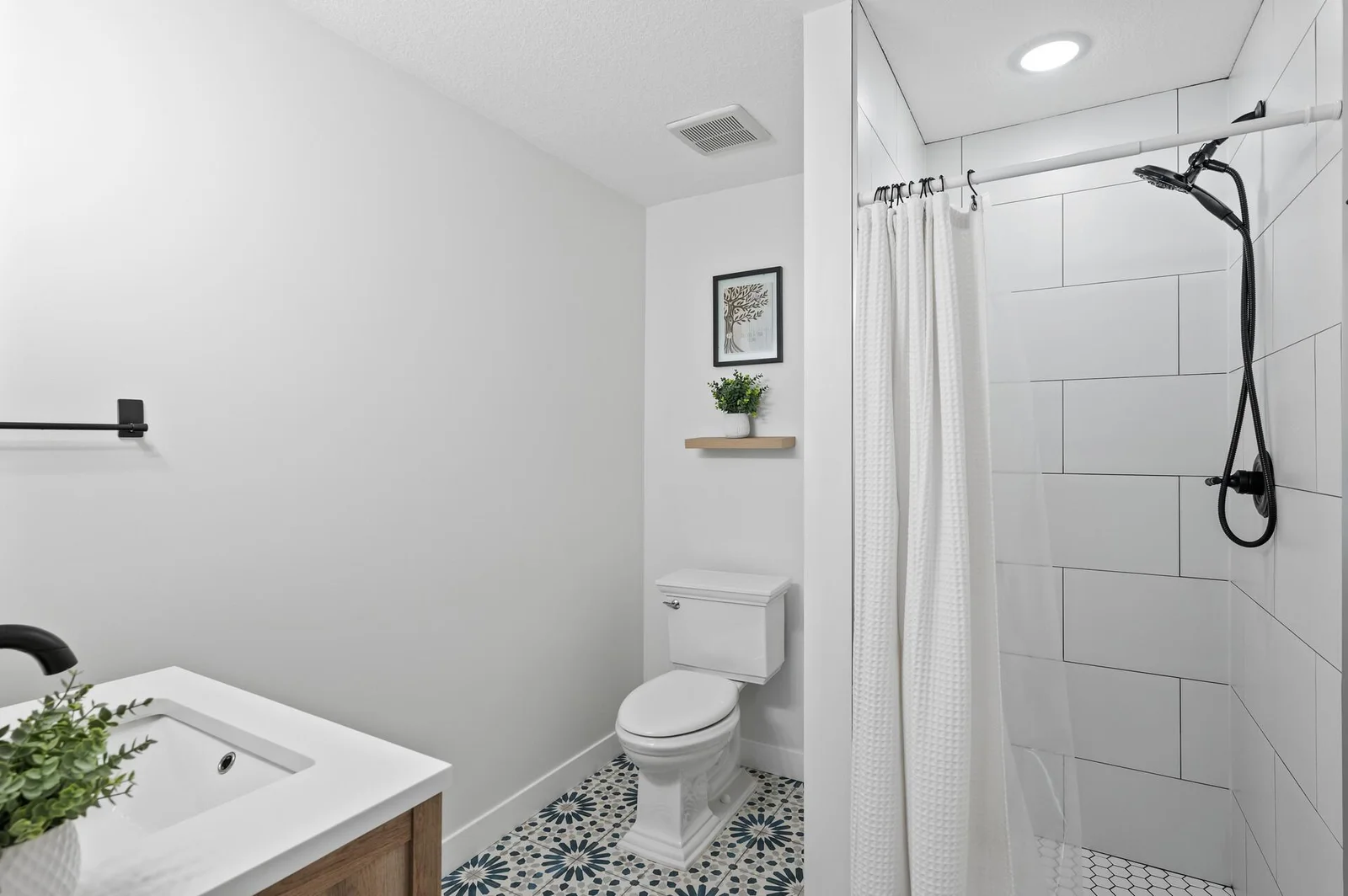 Custom tile floor and shower in this lower level 3/4 bath.