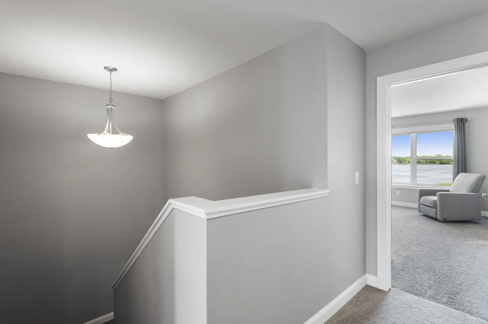 High-ceilings in the stairway help with the open and airy design and feel.
