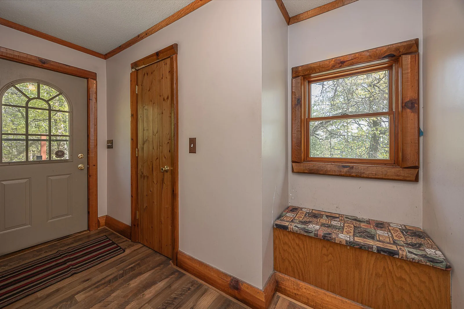 Large main floor entryway with sitting nook.