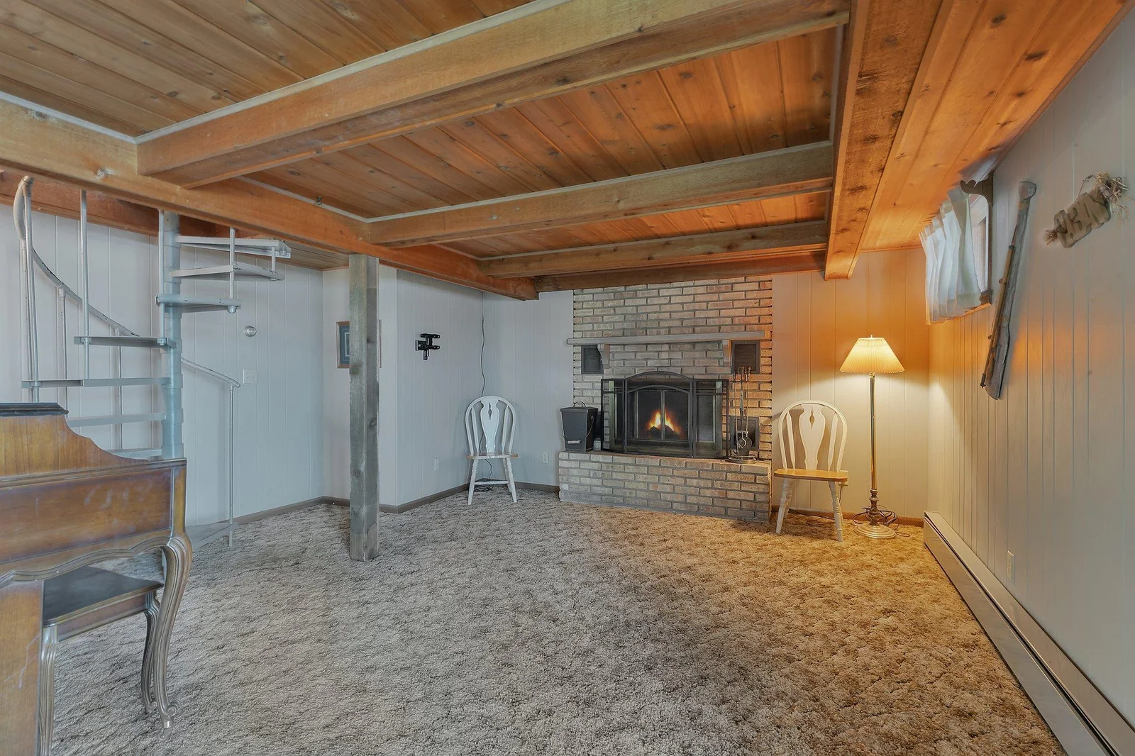 Family room in the lower level with wood fire place