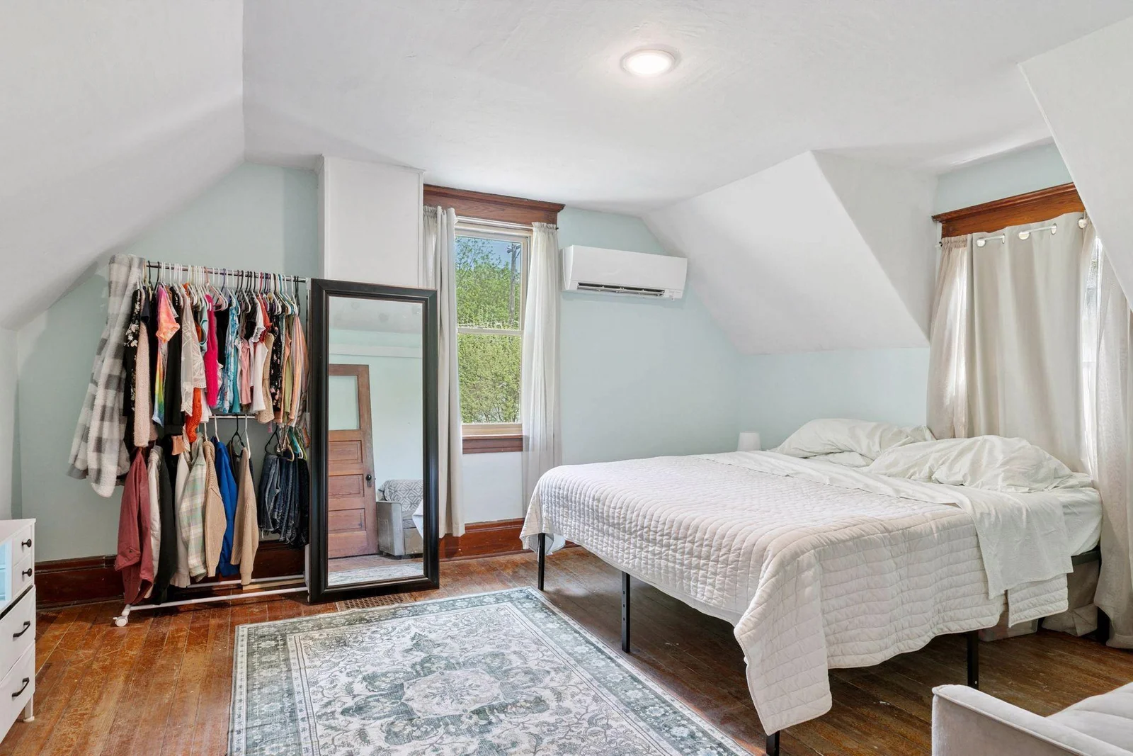 Spacious bedroom! Gorgeous wood flooring, and another updated mini split to keep it comfy!
