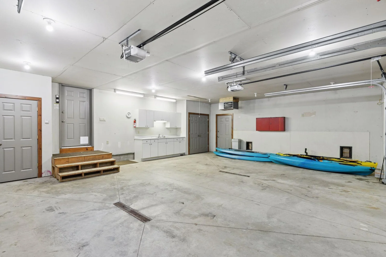 Oversized 2+ car attached garage is heated and insulated with floor drain and optional kennel set-up