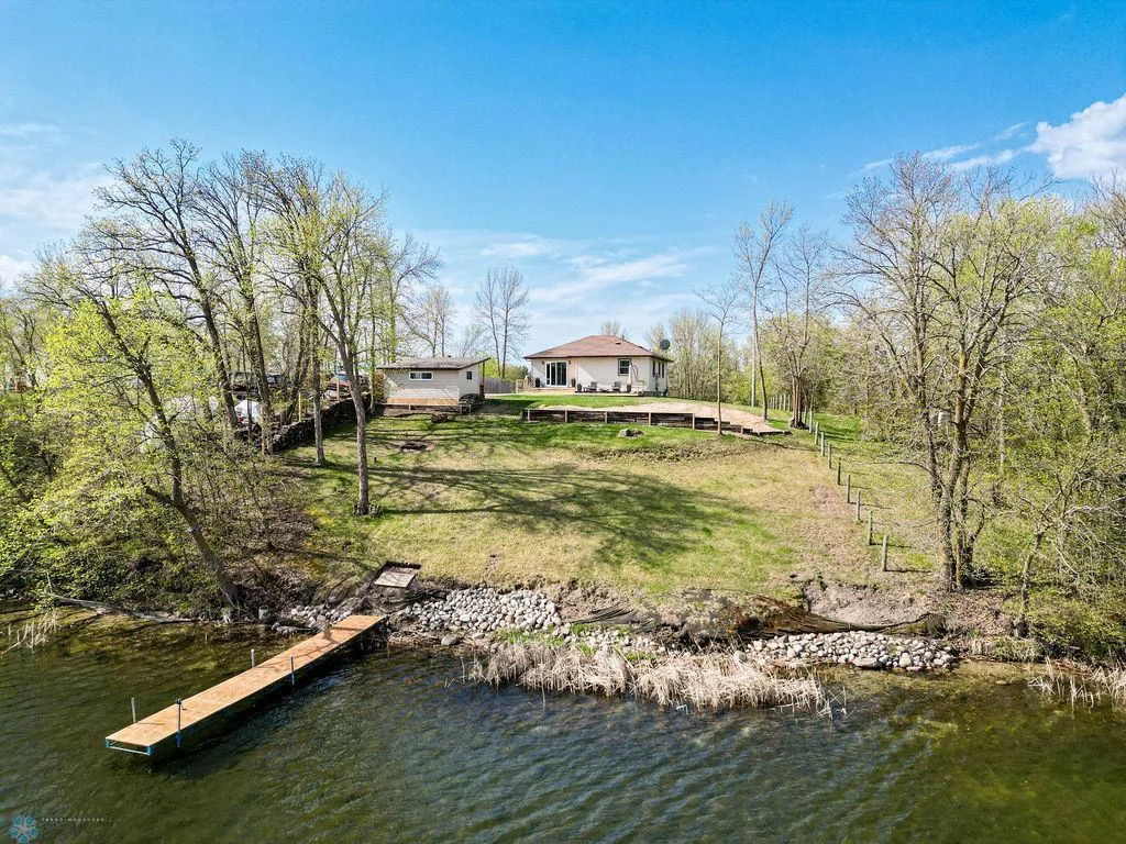 Home sits on the south side of the lake with northeast exposure
