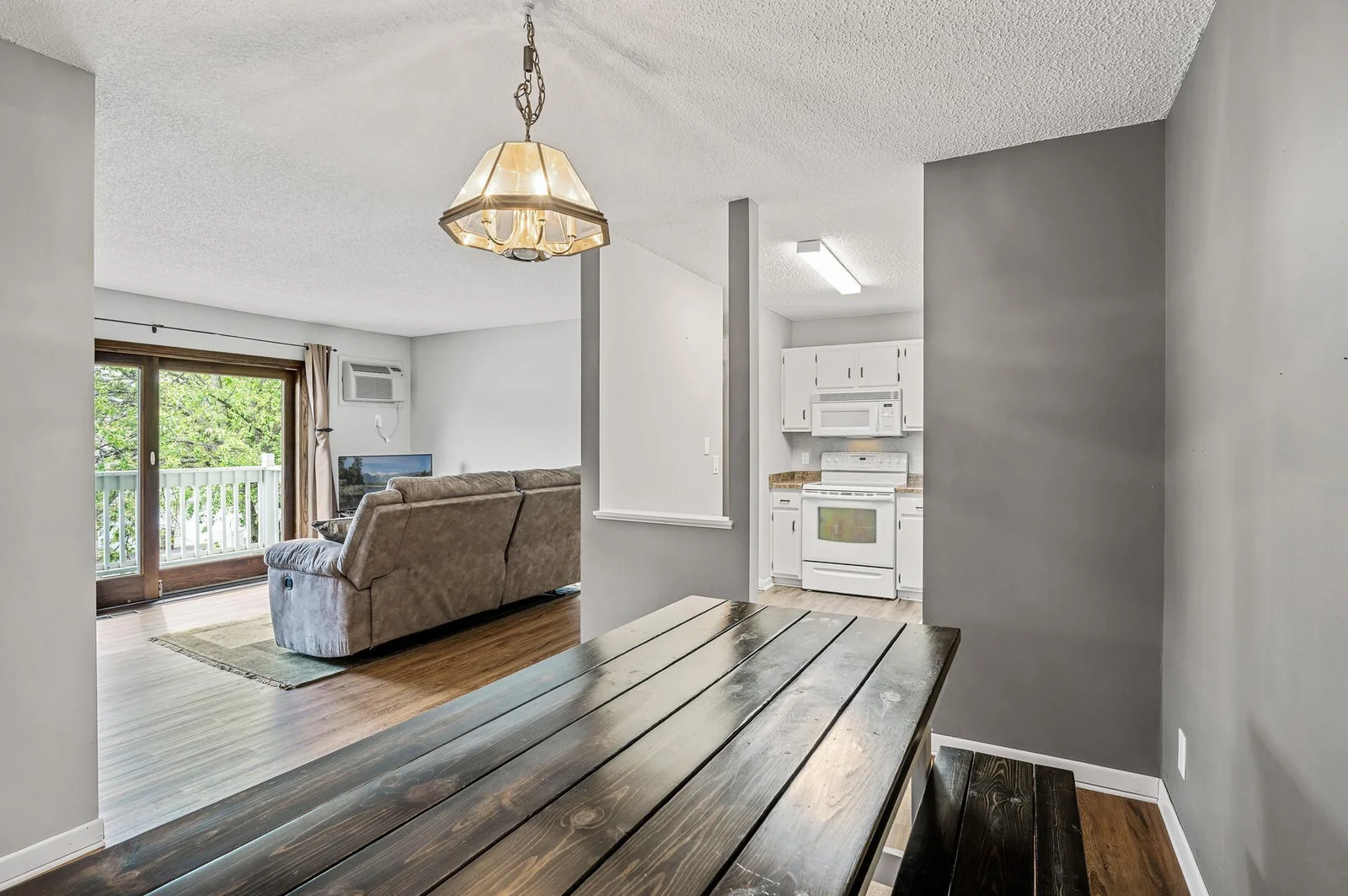 Dining room with peeks into kitchen and living room