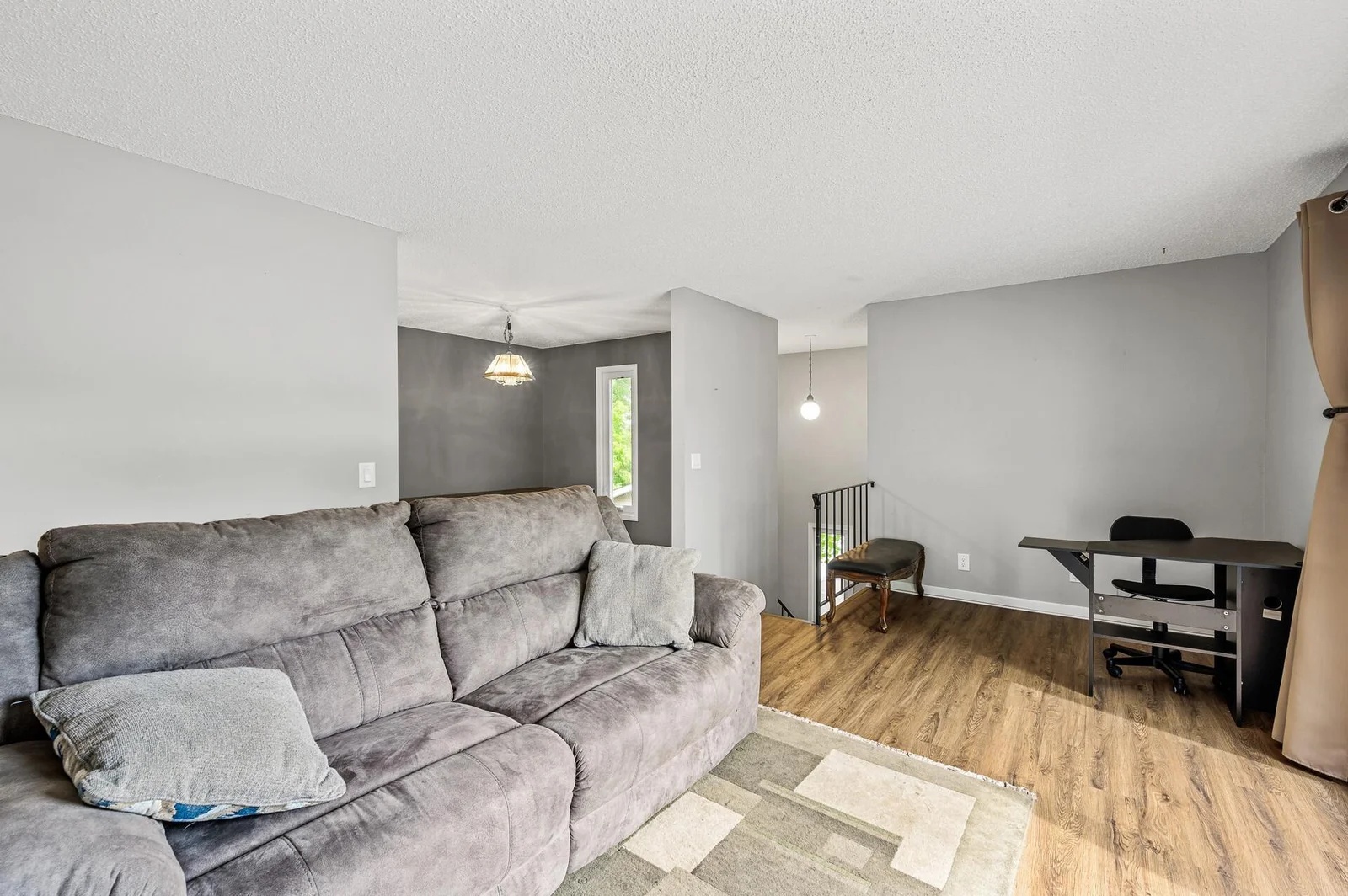Living room and peeks into dining room