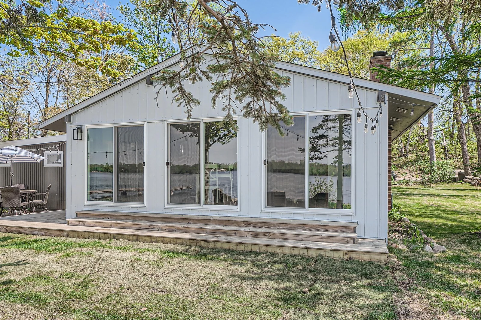 Sliding doors provide stunning water views and effortless access to the backyard and dock.