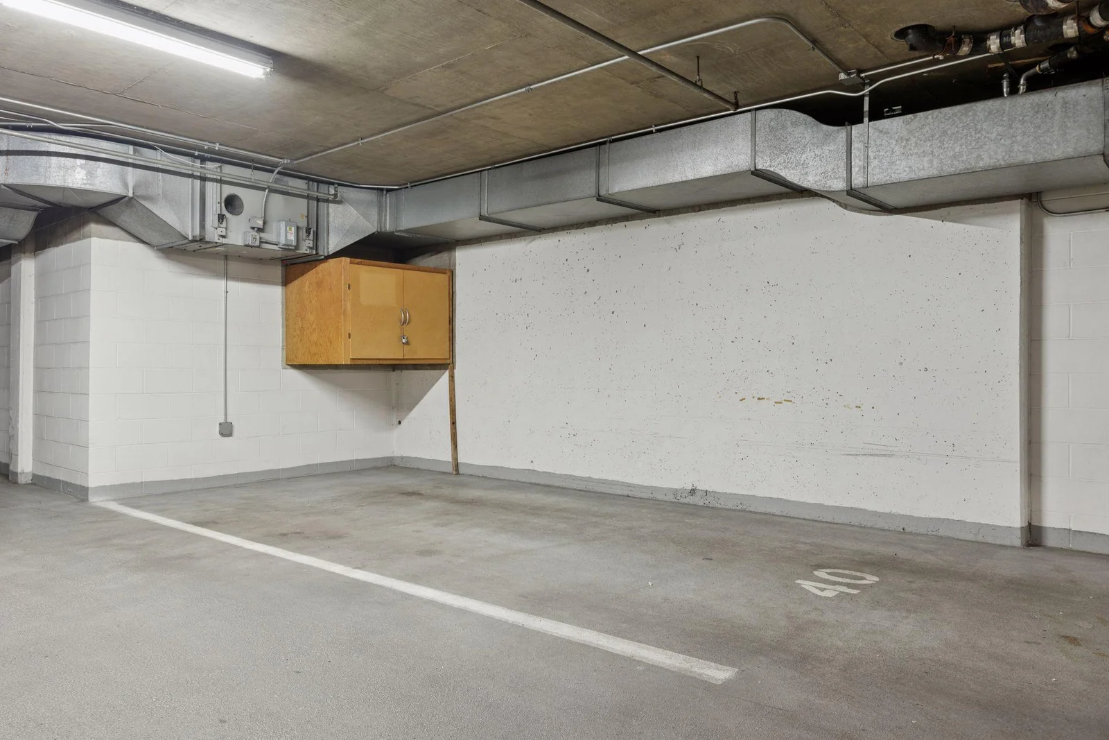 Amazing heated garage stall with storage cabinet
