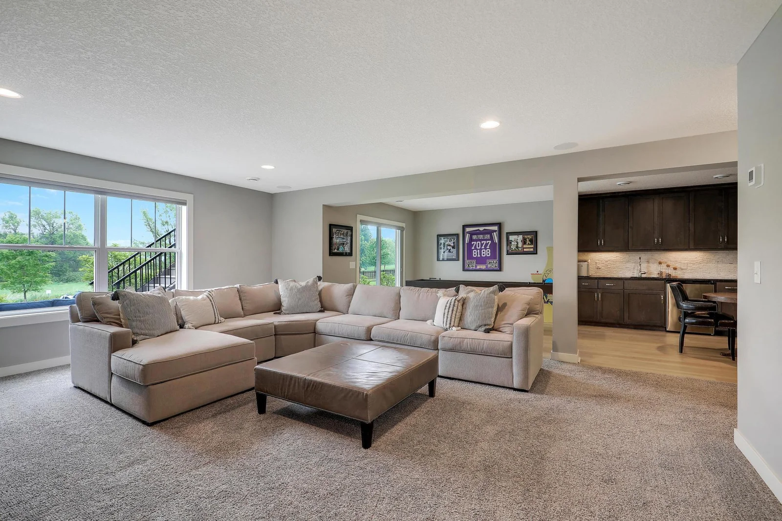 Fully finished walk out lower level includes family room, wet bar/game room area