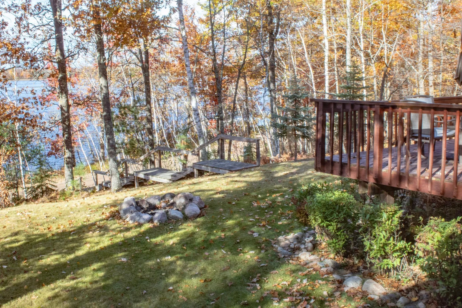 Firepit and stairs leading to lake