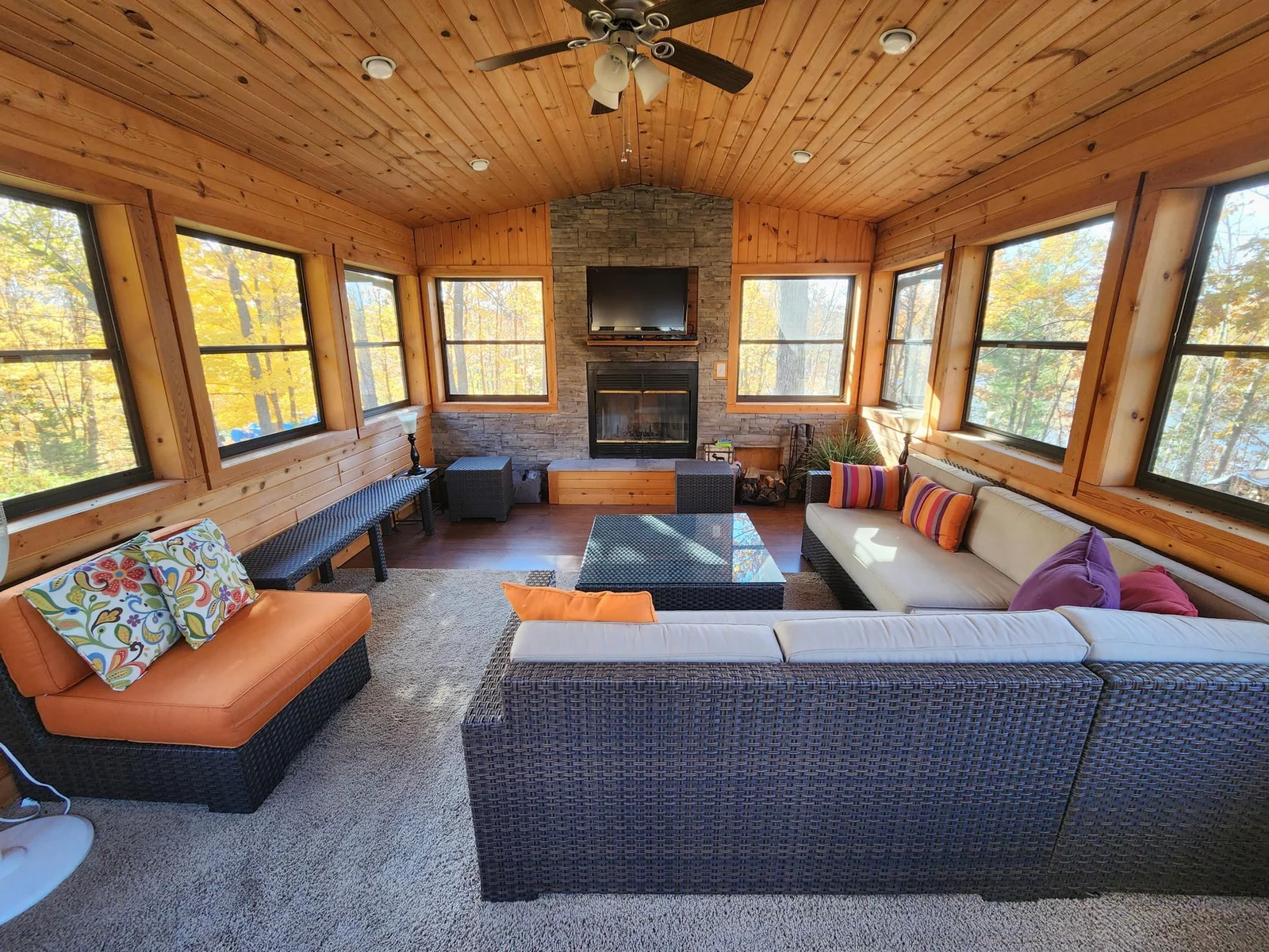 Fabulous screened in "porch", extra living room/living space with wood burning fire place.