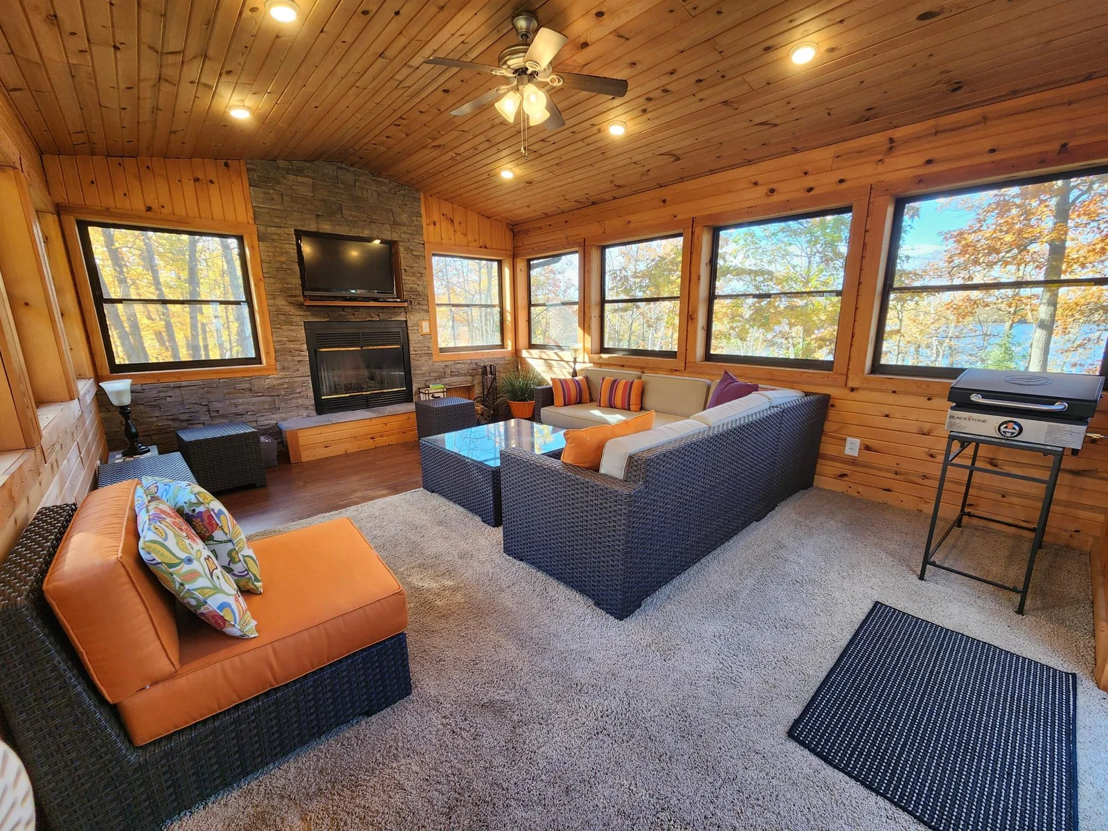 Fabulous screened in "porch", extra living room/living space with wood burning fire place.
