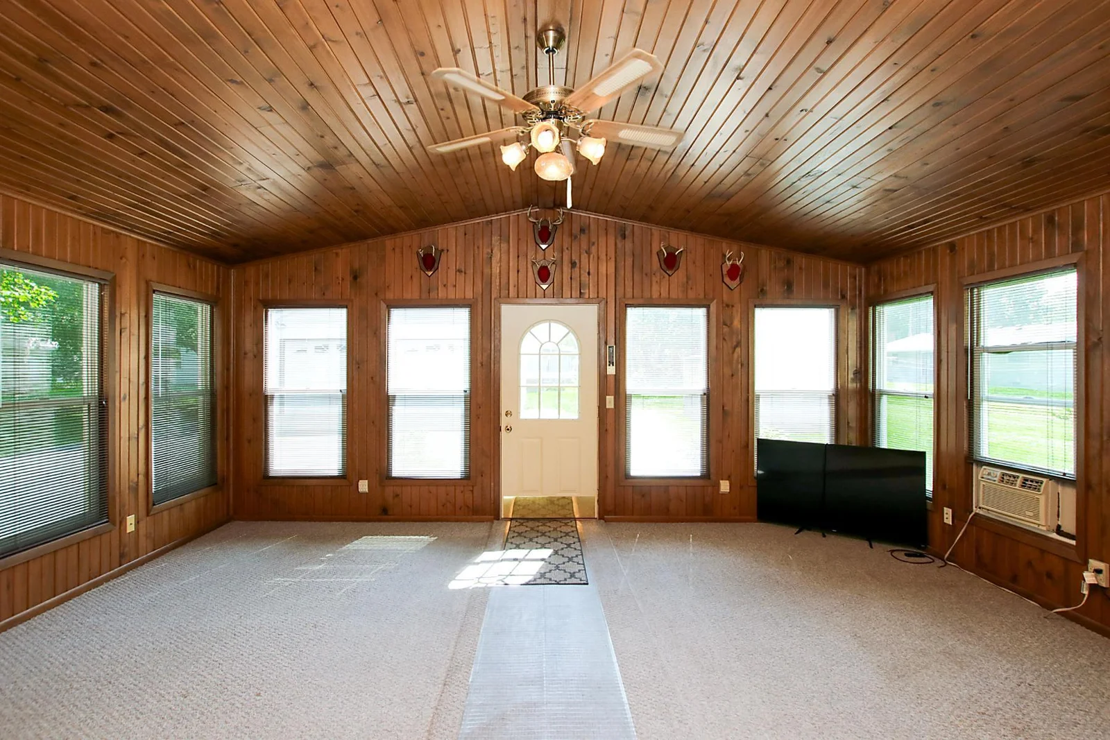 Wrapped in cozy wood and engulfed by sunlight, this living space is huge!