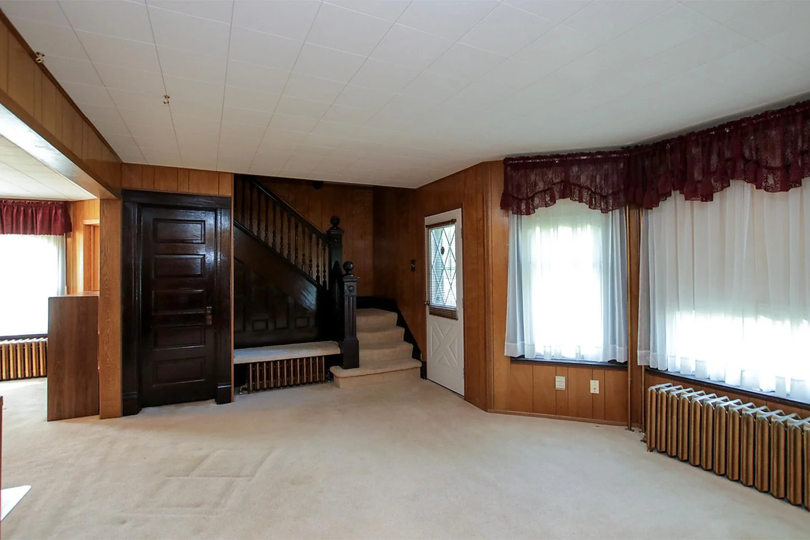 Look at that wood work, built in bench and coat closet