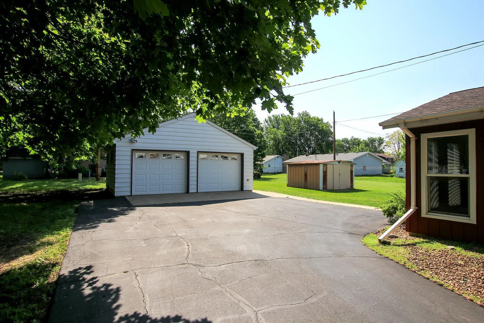 Asphalt driveway leads to your 2-Stall Garage!