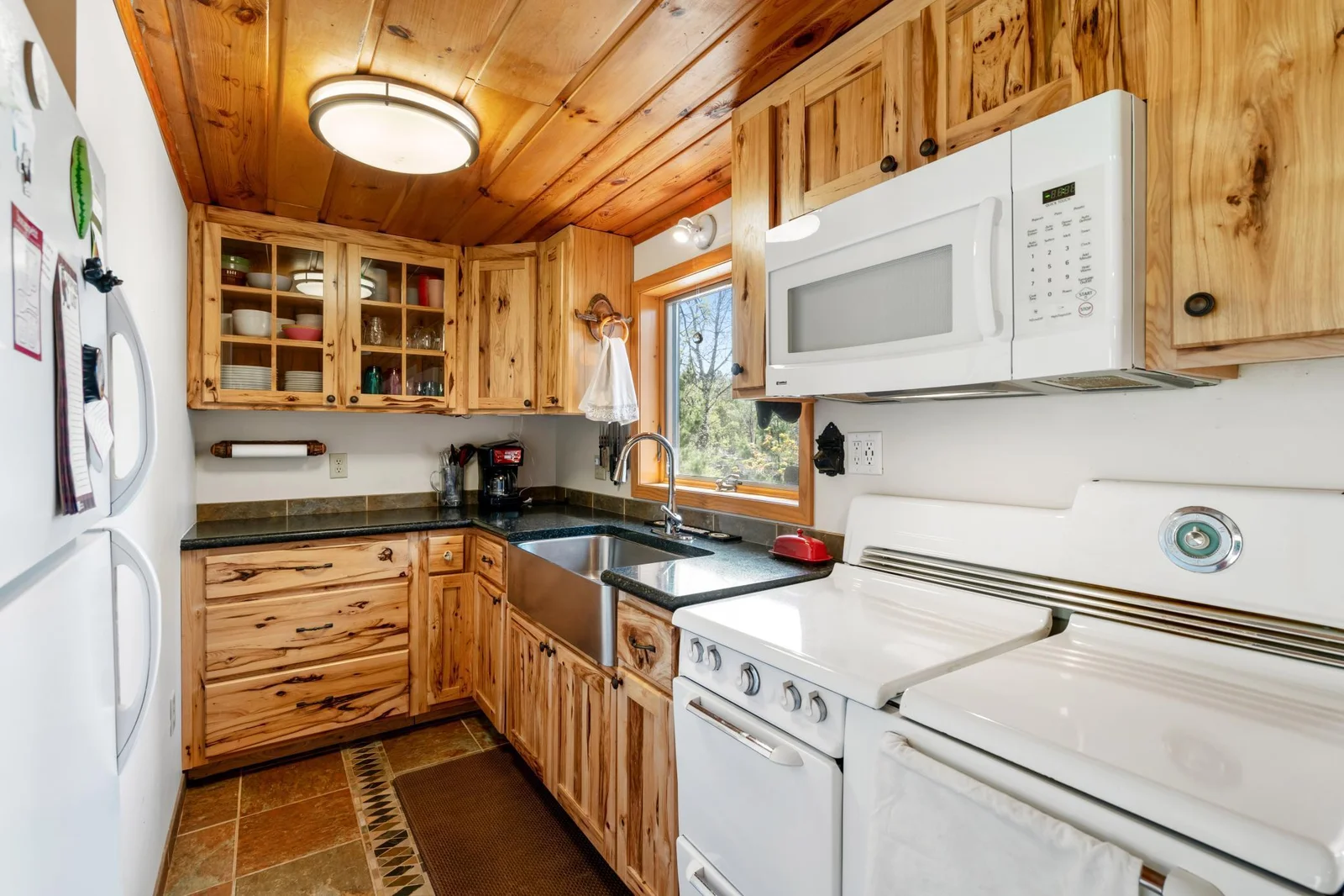 Updated kitchen with Tile and Hickory Cabinets