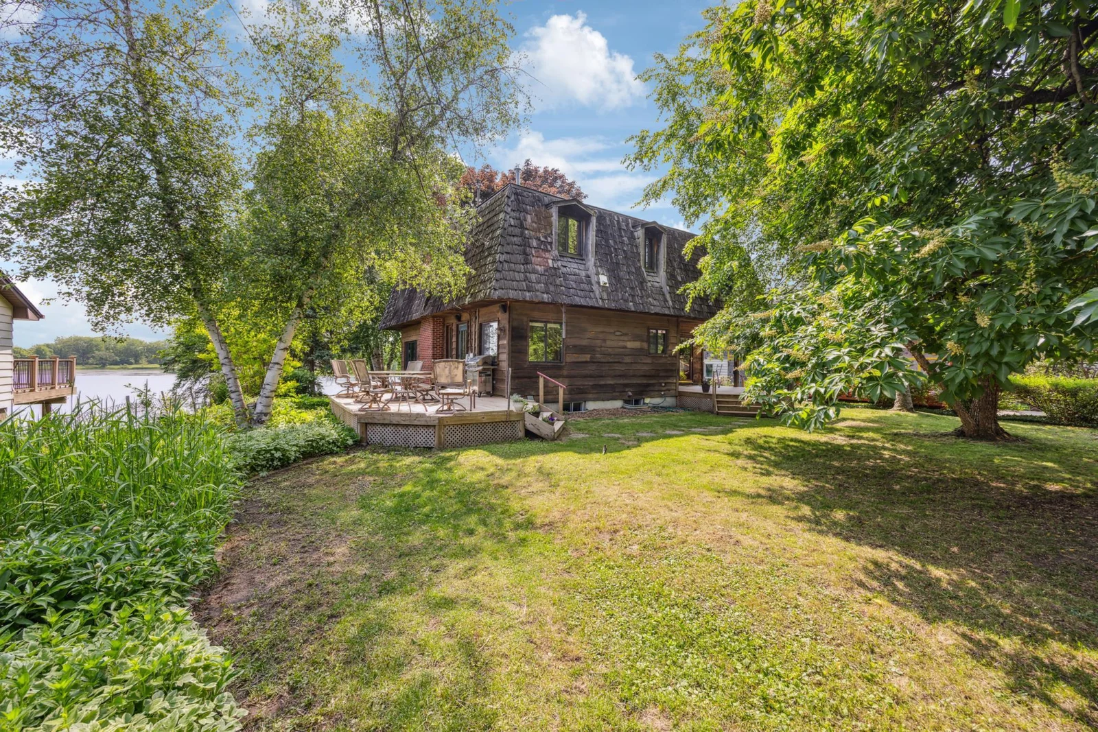 This shows the deck on the side of home overlooking the lake.
