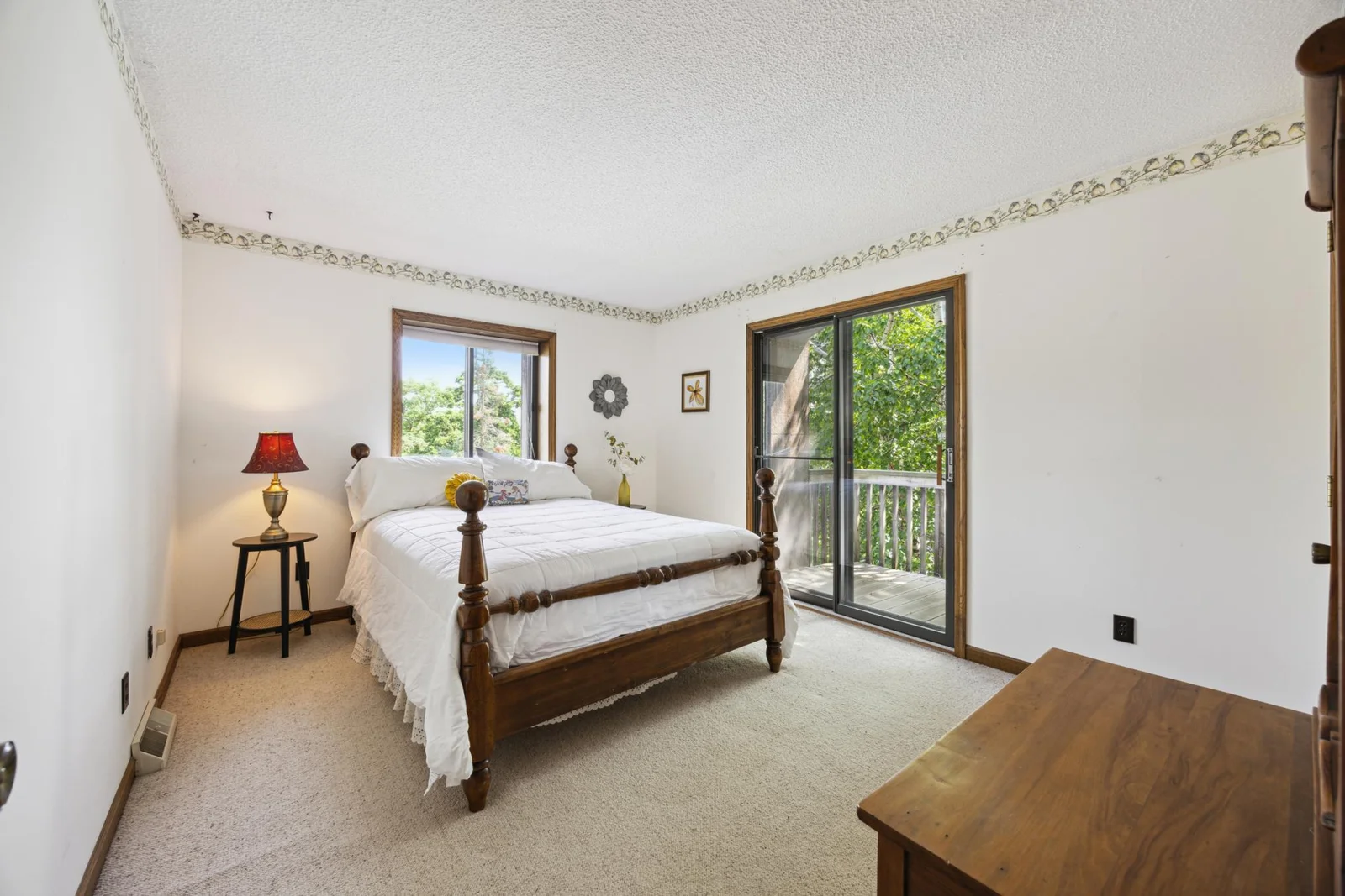 Second bedroom upstairs with another balcony and patio door.  Overlooking the lake.