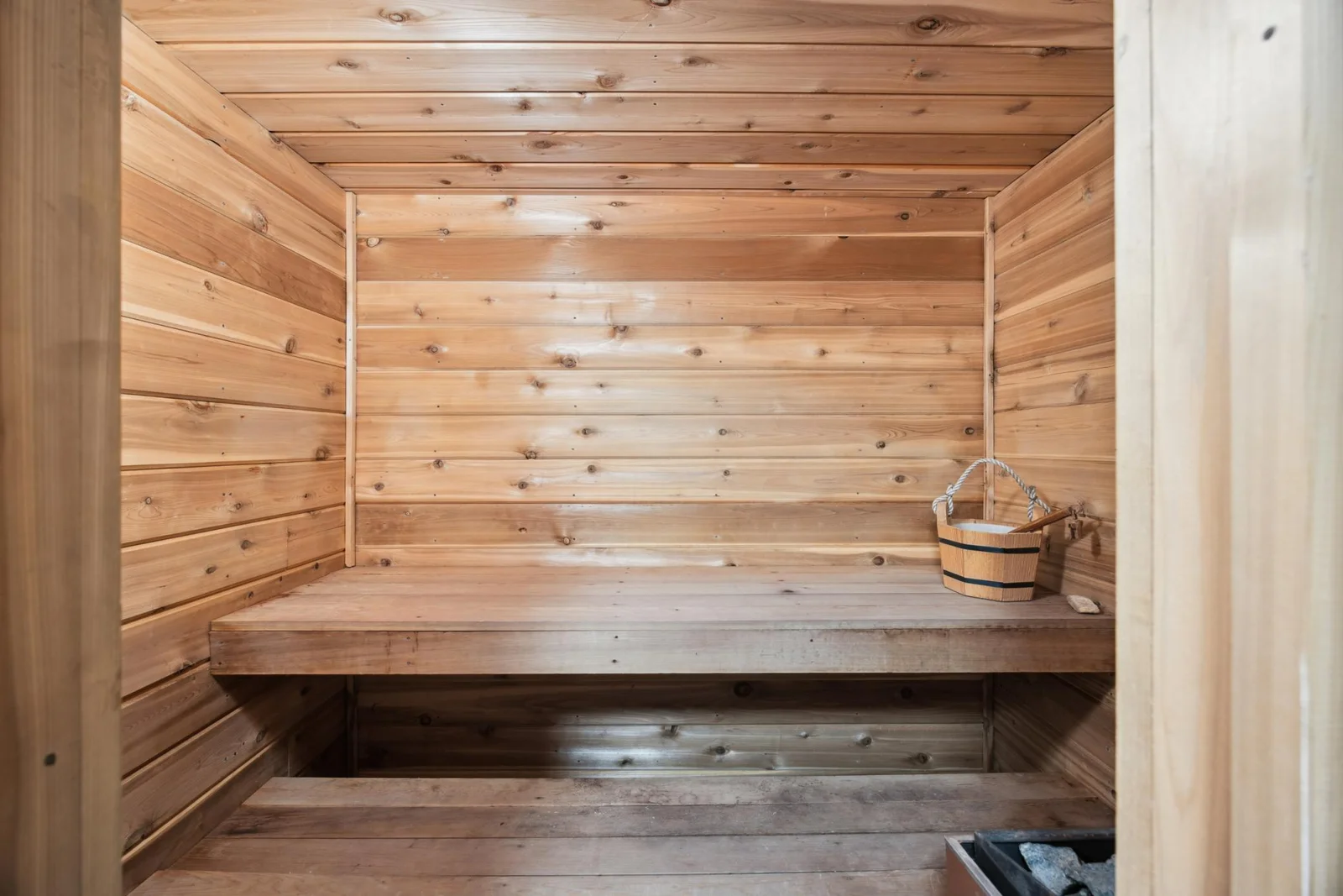 Sauna connected to bath with shower on lower level.