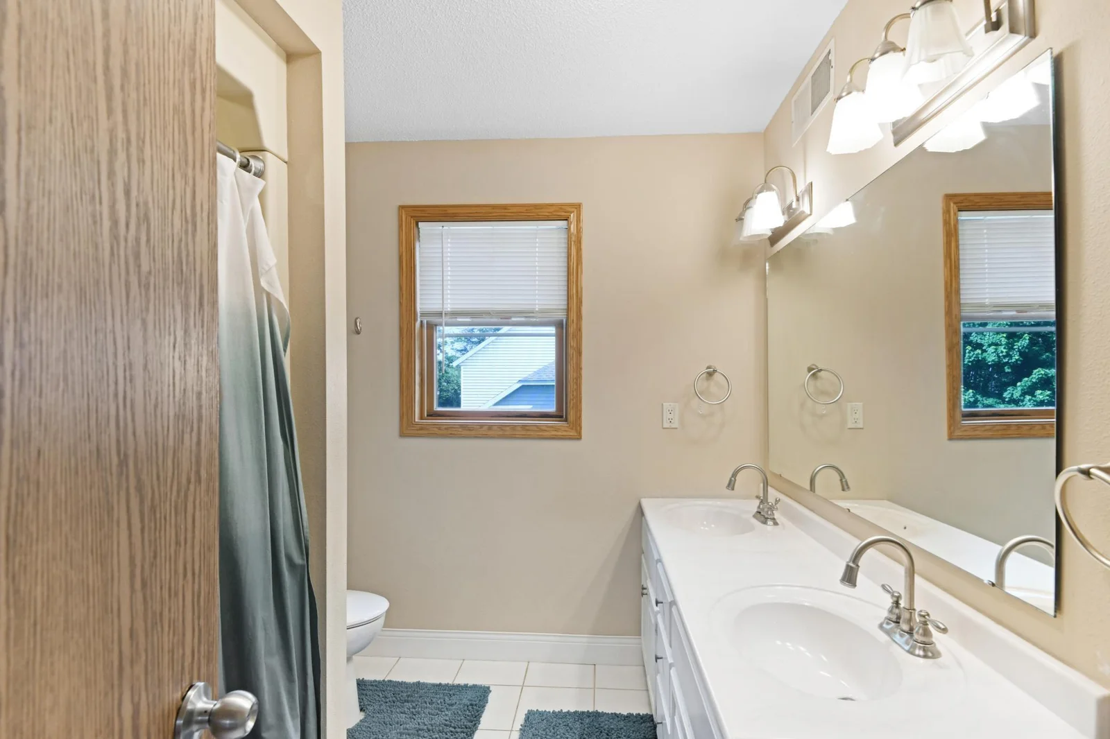 Full main bath on upper level with double vanity
