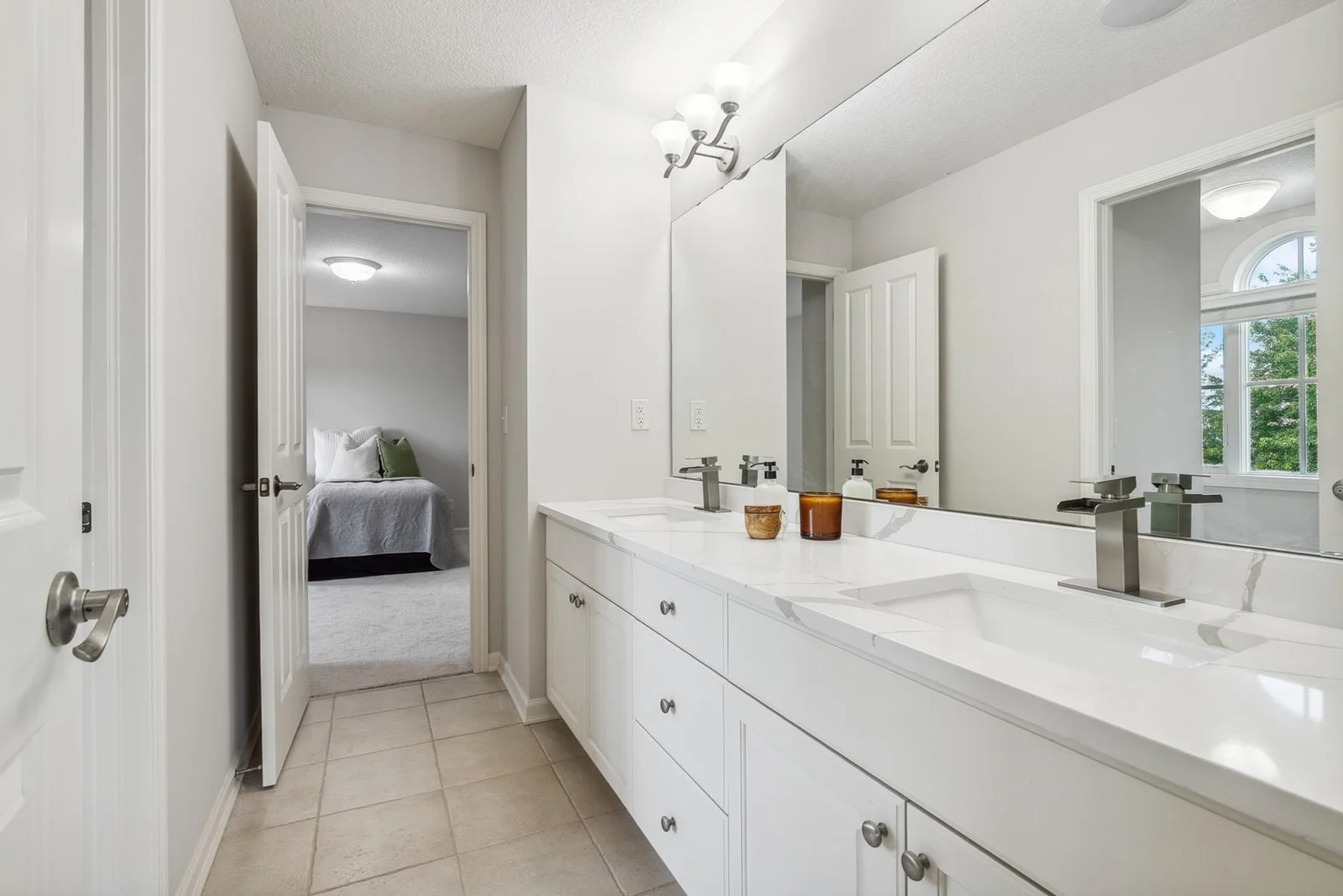 Jack and Jill bath offers privacy while maximizing functionality for busy mornings.