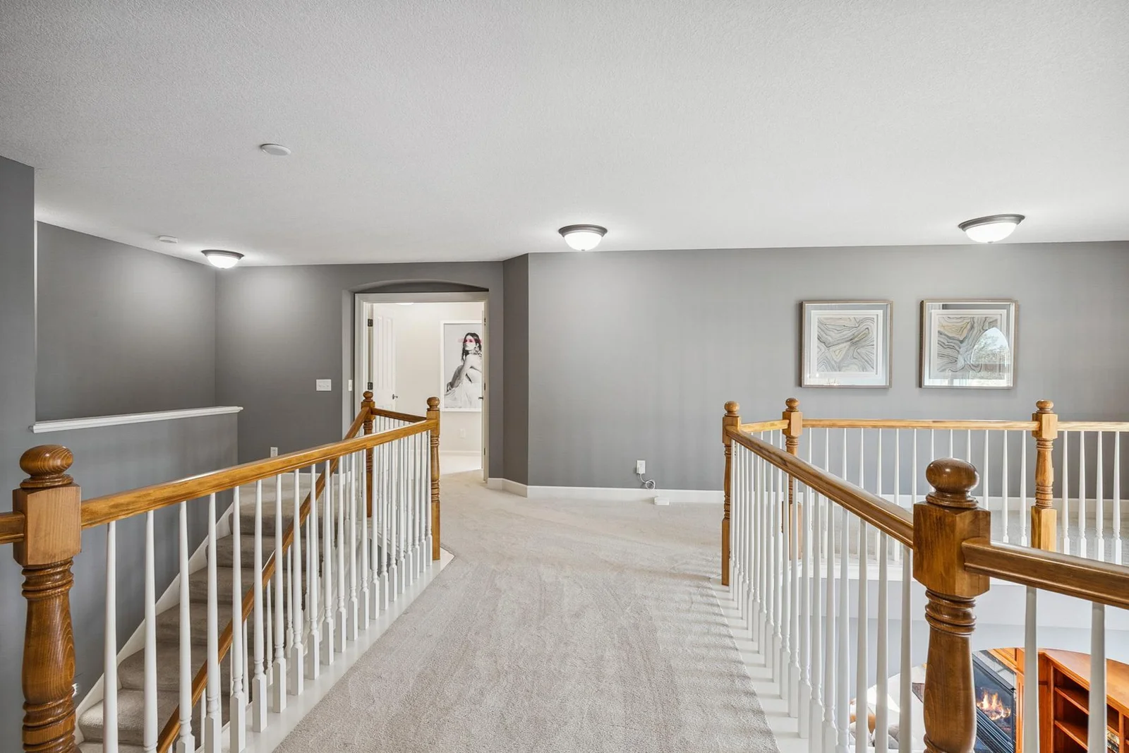 Elegant upper-level catwalk that adds architectural interest and connects the home’s open design.