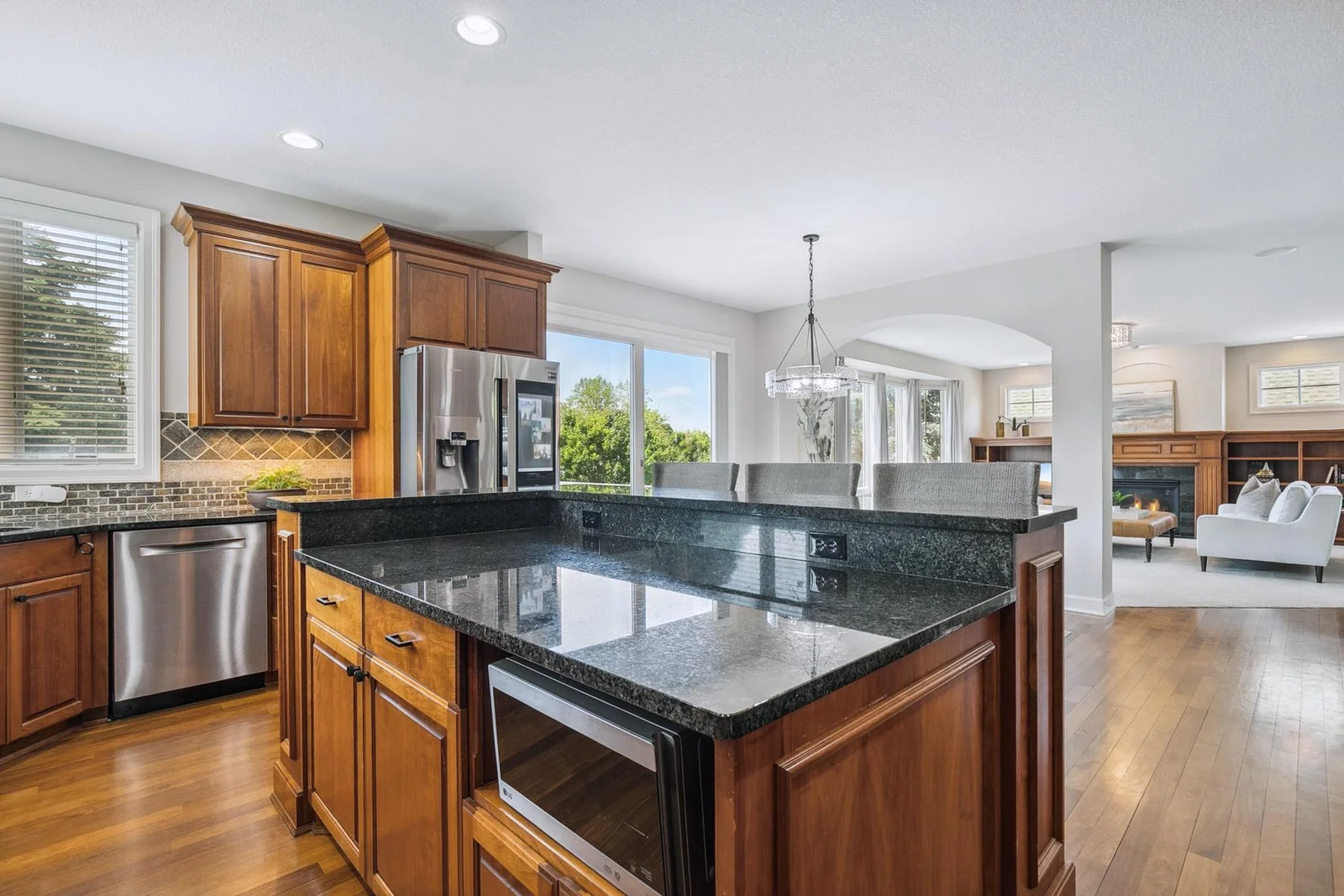 Kitchen opens to a cozy café dining area—perfect for casual breakfasts or intimate dinners.