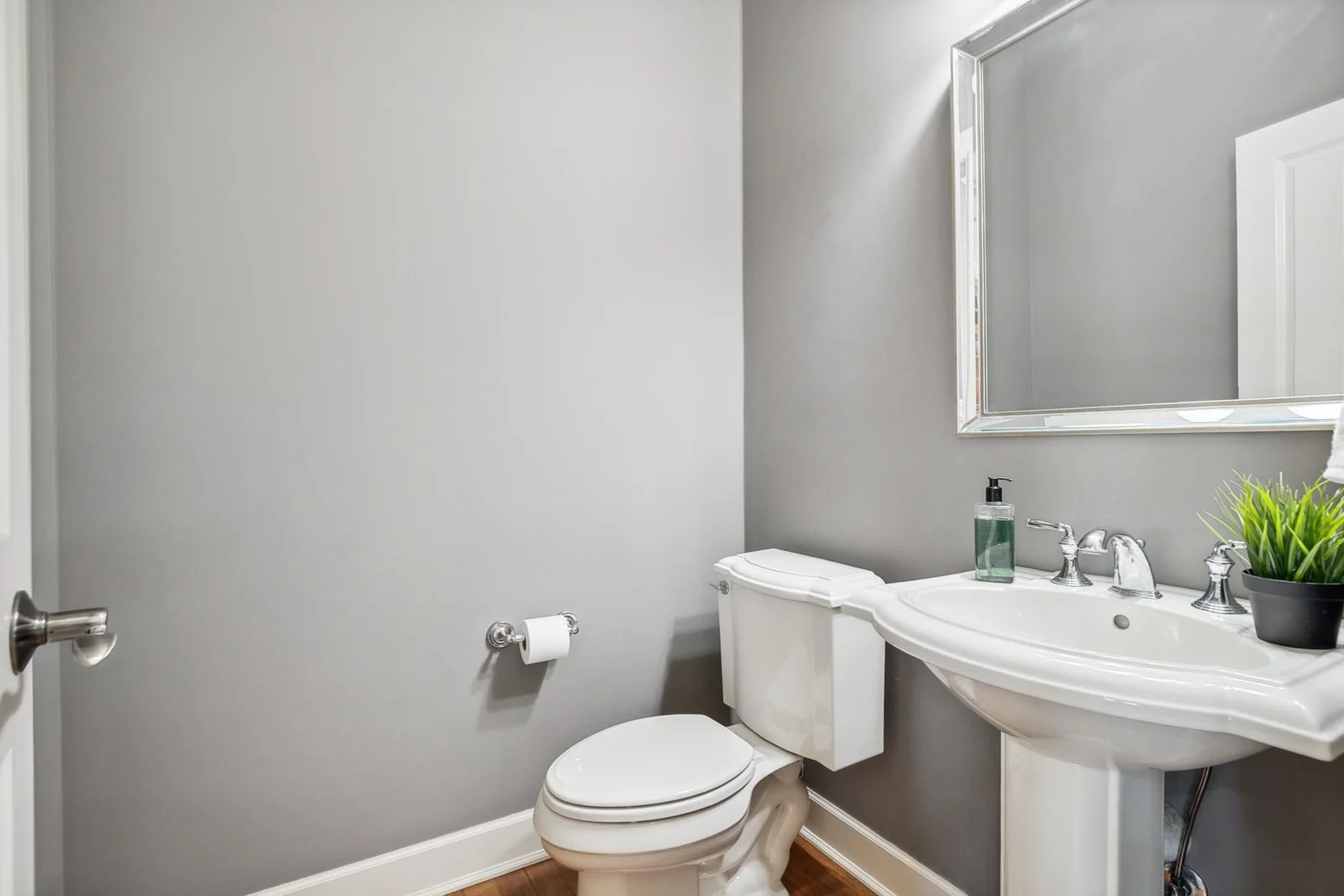 Conveniently located half bath with elegant finishes for guests and everyday use.
