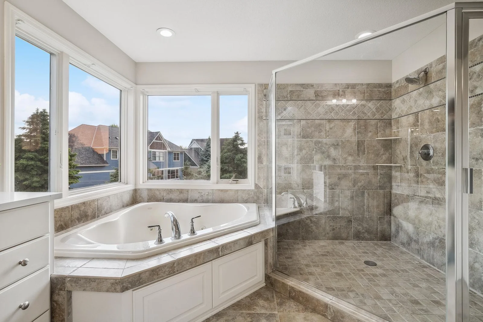 Thoughtfully designed primary bath combining functionality with sophisticated style.