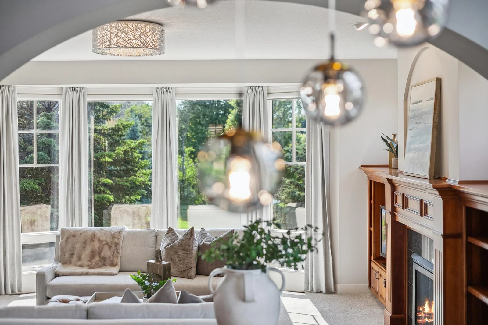 A breathtaking backdrop for entertaining—this two-story dining space is pure sophistication.