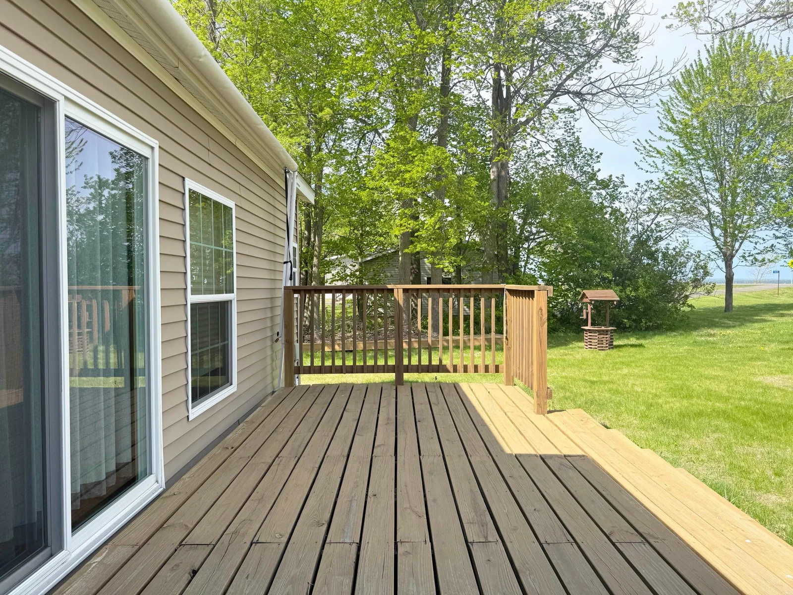 A shot of the deck. The lot has city sewer and the well is in the wishing well structure at the back of this photo.