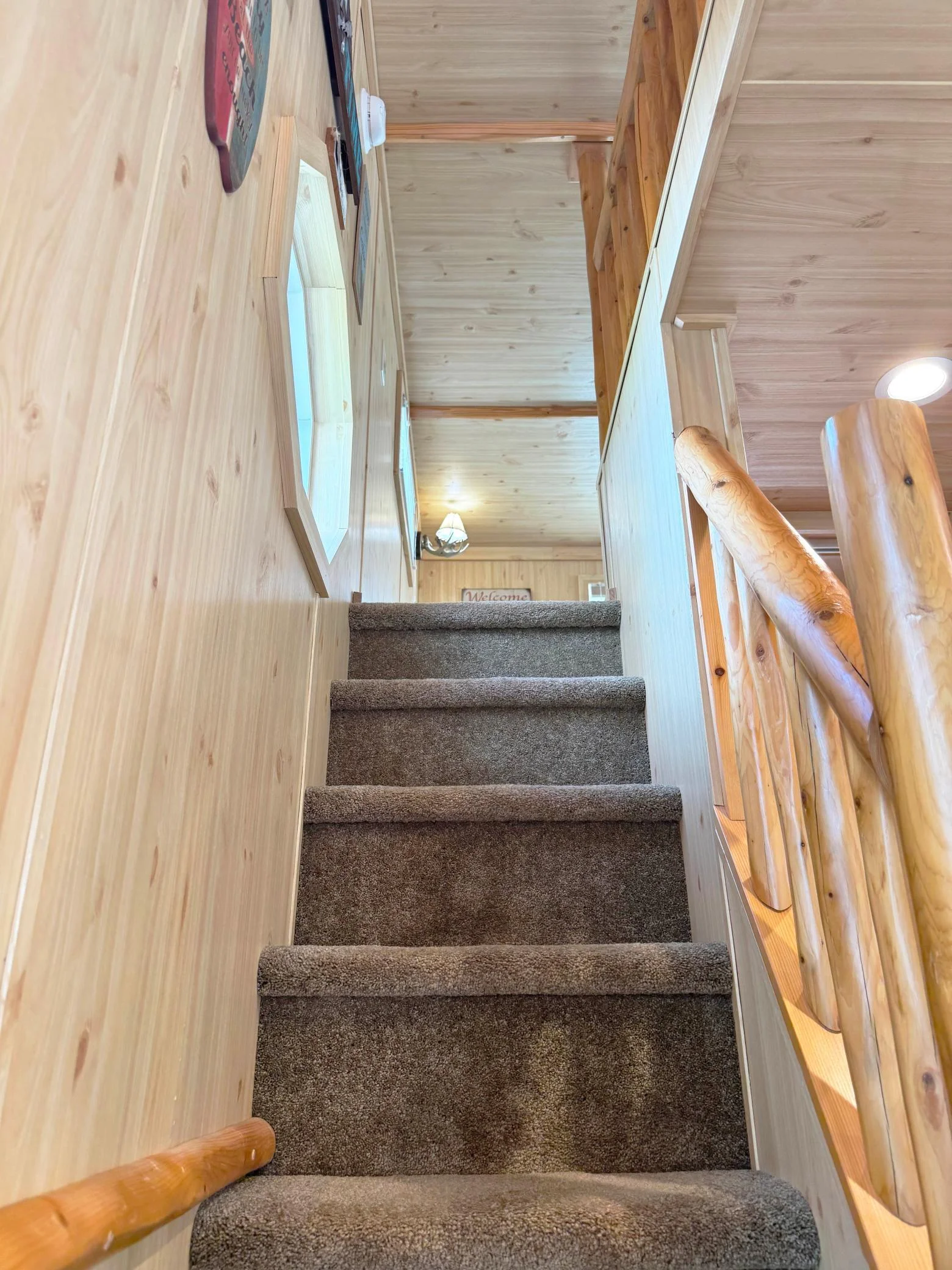 Walking up the stairs to the upper level loft.